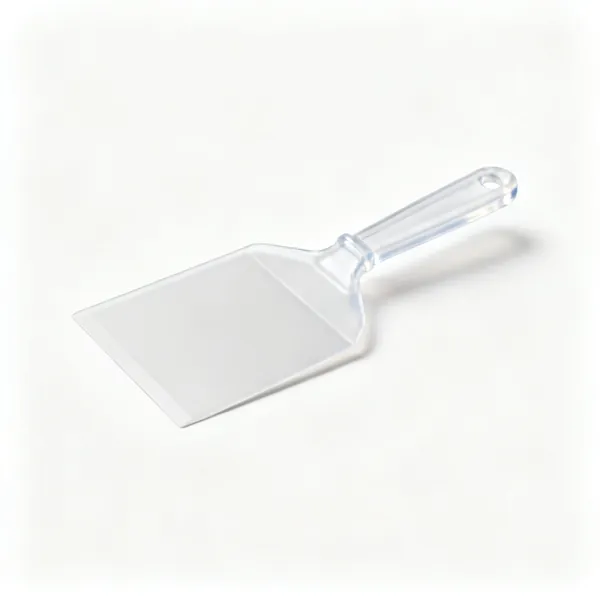 A flat plastic icing smoother scraper