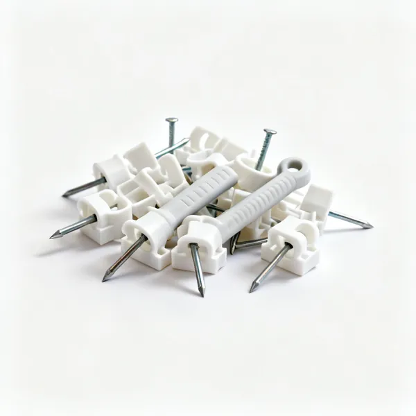 A handful of white plastic cable clips with nails
