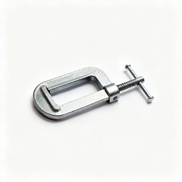 Small F clamp: A small steel F clamp with a sliding jaw on a flat bar and a screw handle
