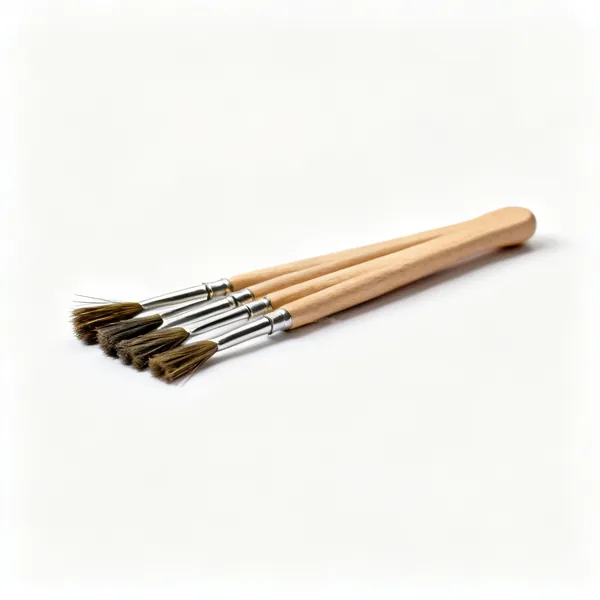 Several small stiff bristled acid flux brushes with wooden handles