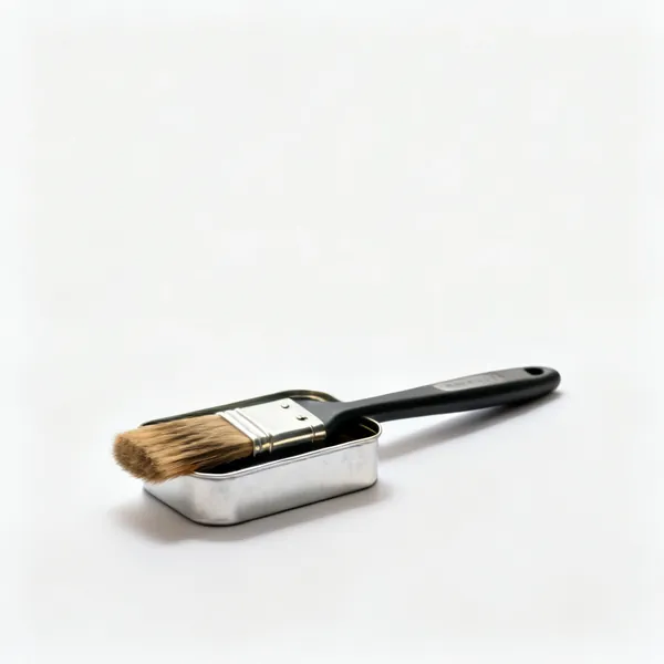 A tin of brush cleaner with a brush