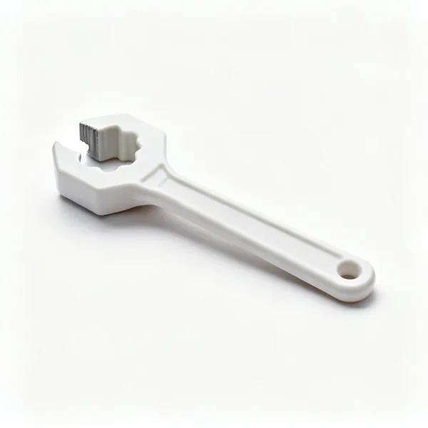A plastic tap turner lever with a shaped socket end and a long moulded handle