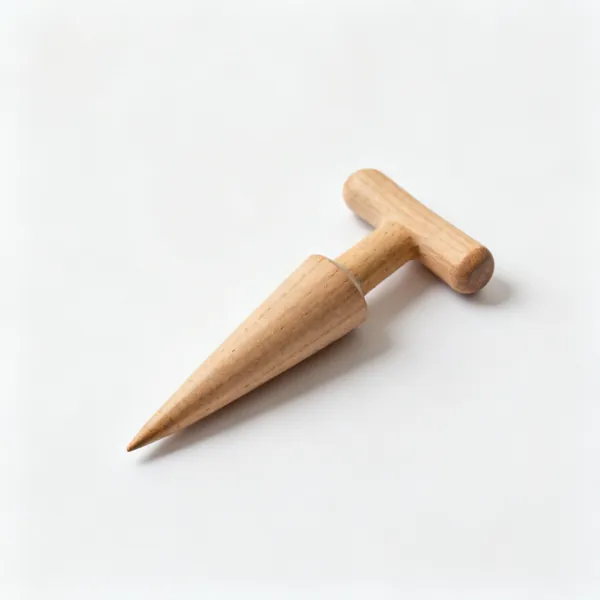A small wooden dibber, a tapered pointed wooden tool with a rounded T handle