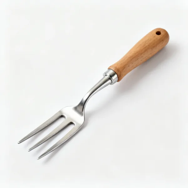 A stainless steel hand fork with three short tines and a wooden handle