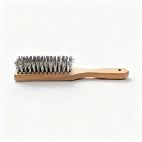 A hand wire brush with rows of stiff steel bristles and a wooden handle