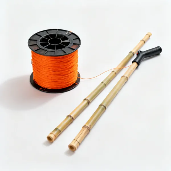 String line and canes: A string line reel with bright orange builders line beside two bamboo canes