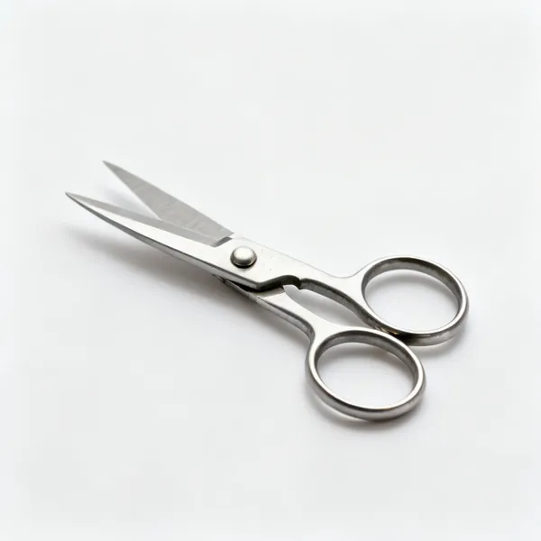 A pair of small japanese topiary shears with round steel blades and looped handles