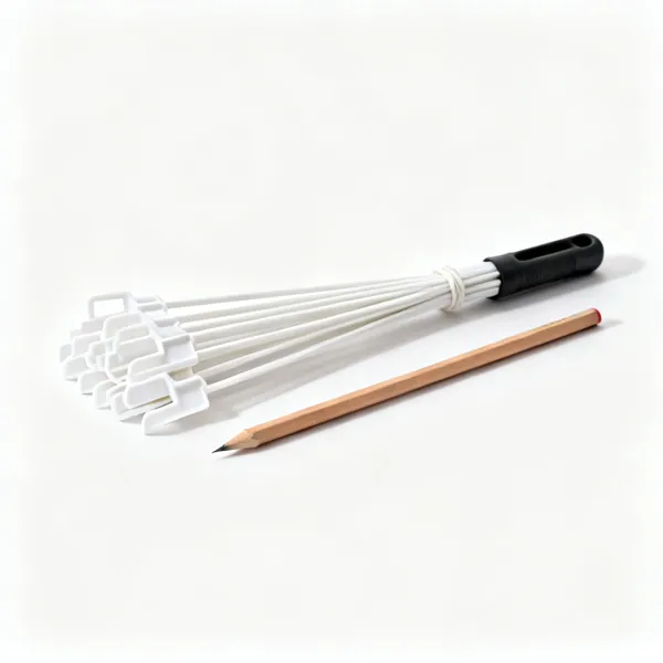 Labels and pencil: A bundle of white plastic plant labels beside a pencil