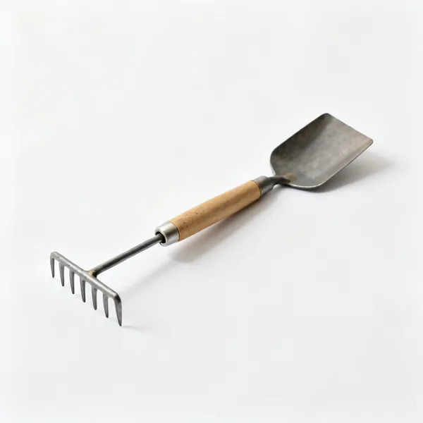 A japanese root rake and spatula combination tool with a small rake at one end