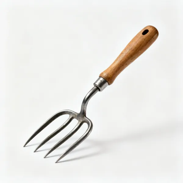 Three prong cultivator: A japanese forged three prong hand cultivator with curved steel tines and a wooden handle