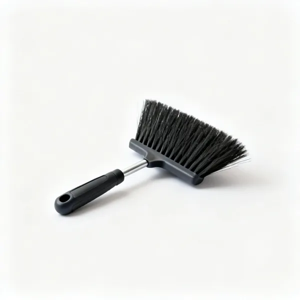 A stiff bristled outdoor yard brush