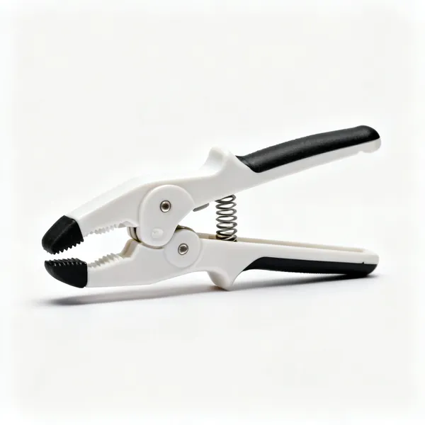 A plastic one handed spring clamp with rubber tipped jaws and a coil spring