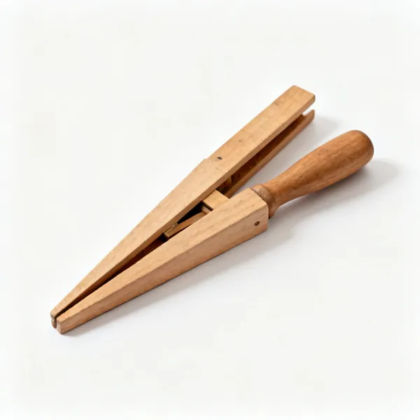 Two tapered wooden folding wedges lying against each other