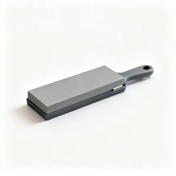 A small rectangular grey pocket sharpening stone