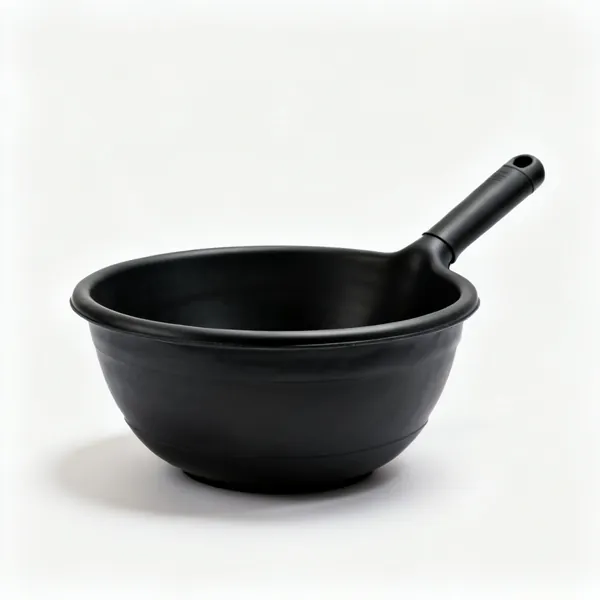 A large black rubber mixing tub, a shallow flexible round container