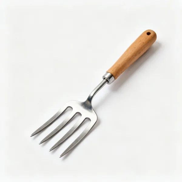 A potato fork with four flat wide blunt ended steel tines and a wooden shaft