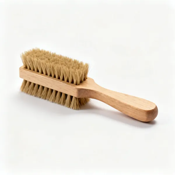 A small wooden handled bench brush with stiff natural bristles