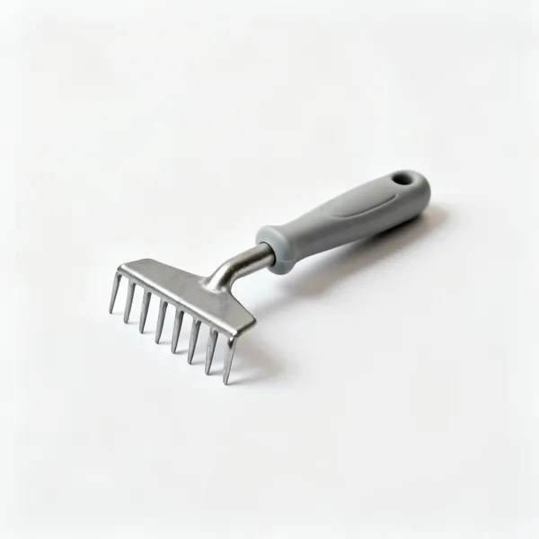 A small hand rake with a short head of rigid steel tines and a moulded handle