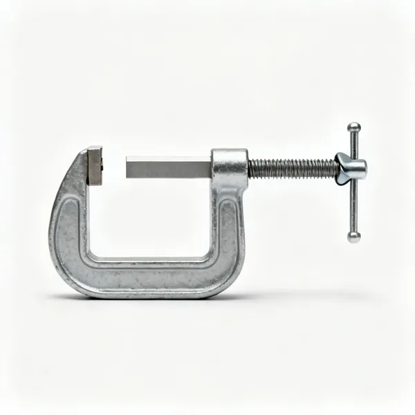 F clamps: A steel F clamp with a sliding jaw on a flat bar and a screw handle with a swivel pad