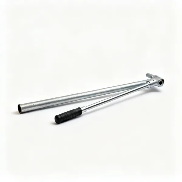 Extension pipe: A length of steel scaffold pipe lying beside a breaker bar