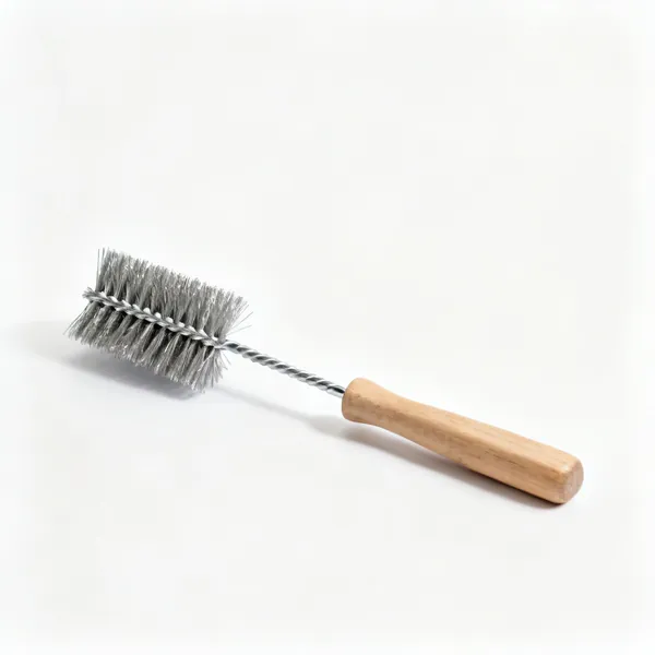 A steel wire brush with a wooden handle