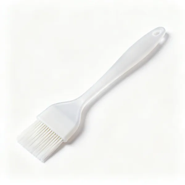 A silicone basting brush with white bristles