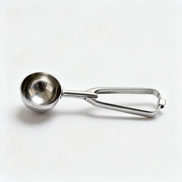 A metal melon baller scoop with a small hemispherical bowl
