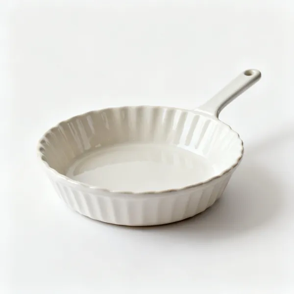 A round ceramic pie dish with fluted sloped sides
