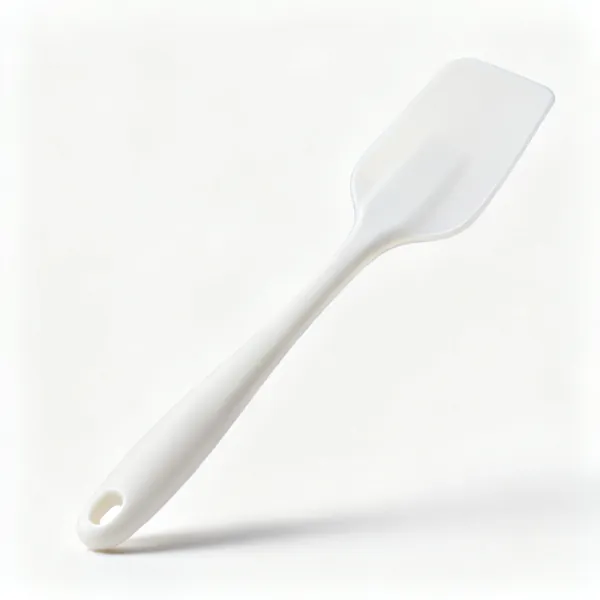 A silicone spatula with a flexible white blade and handle