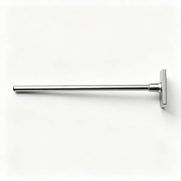 A long steel tamping bar with a flat end