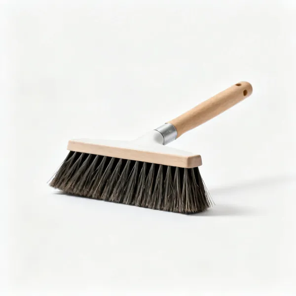 A stiff yard brush