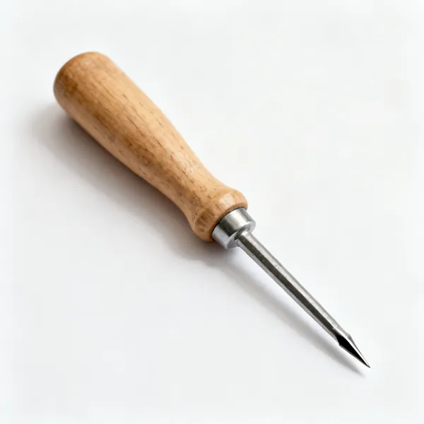 A bradawl with a sharp steel point and a wooden handle
