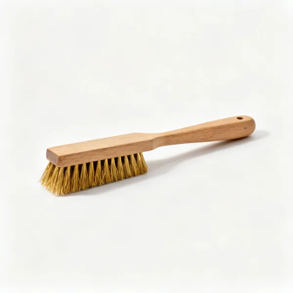Brass brush: A small brass bristled brush with a wooden handle
