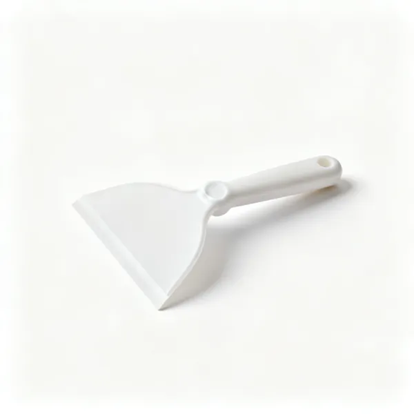 A flexible plastic wallpaper smoothing blade with a rounded edge