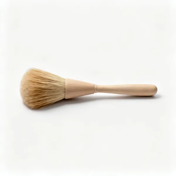 A soft wide dusting brush with natural bristles