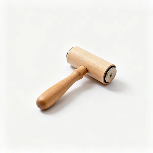 A small wooden seam roller