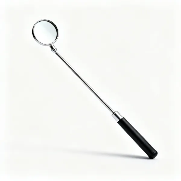 A telescopic inspection mirror with a small round mirror on an extending metal shaft