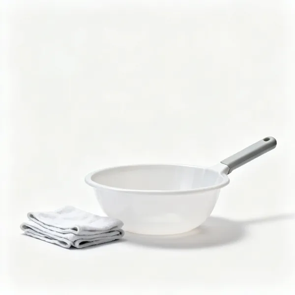 Bowl and cloths: A shallow plastic bowl with folded cloths beside it