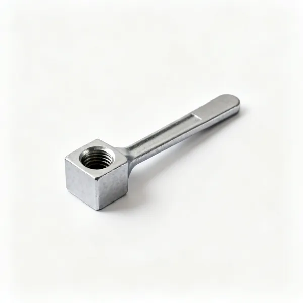 A small steel drain cock key with a square socket and a flat handle