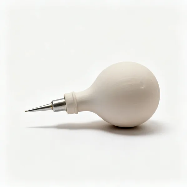 Slip trailer: A pottery slip trailing bulb with a nozzle