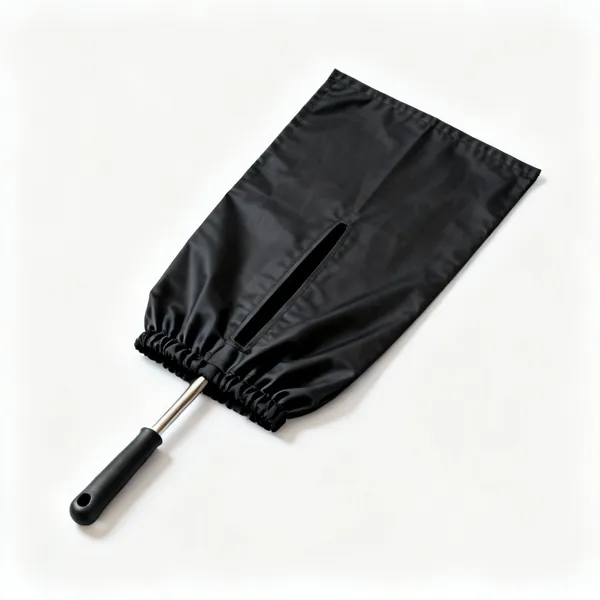 A black chimney sweeping sheet with a rod access slit and elastic edges