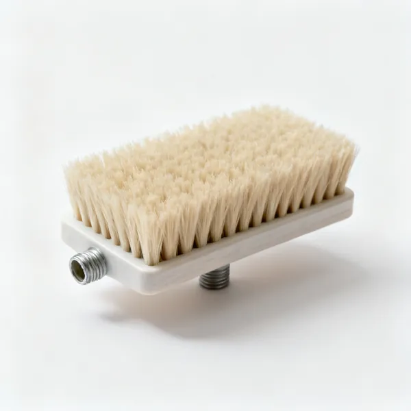Soft brush head: A wide soft bristled cleaning brush head alone, with a short stubby threaded collar on the back