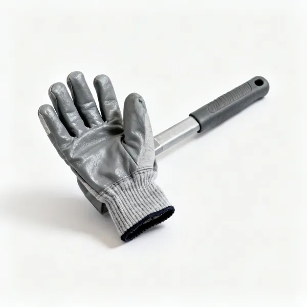 A pair of grey work gloves with coated palms and knitted cuffs