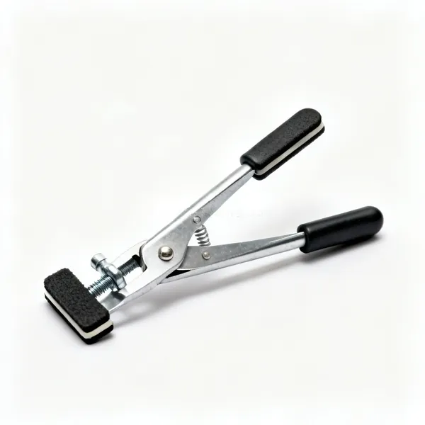 Panel clamps: A pair of small metal sheet holding clamps with rubber pads and screw handles
