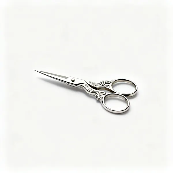 A pair of small sharp embroidery scissors with ornate stork handles