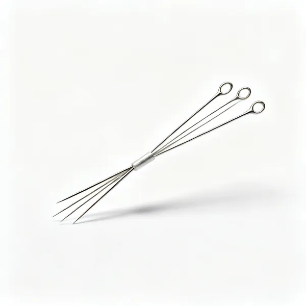 Several long thin basting needles with large eyes