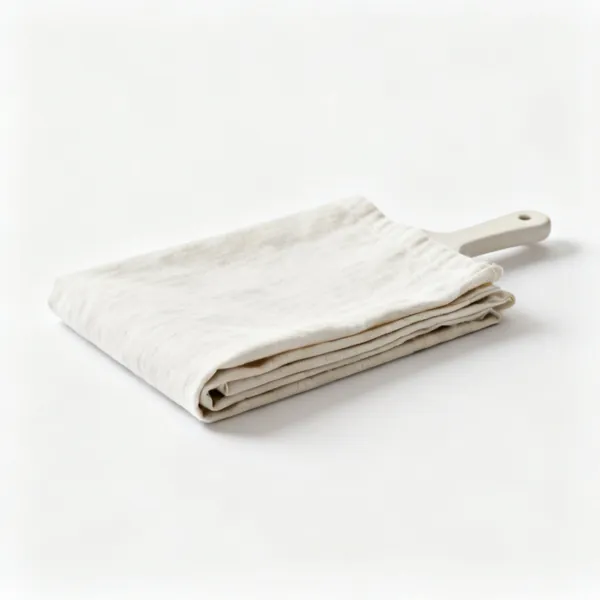 A folded length of plain calico toile fabric