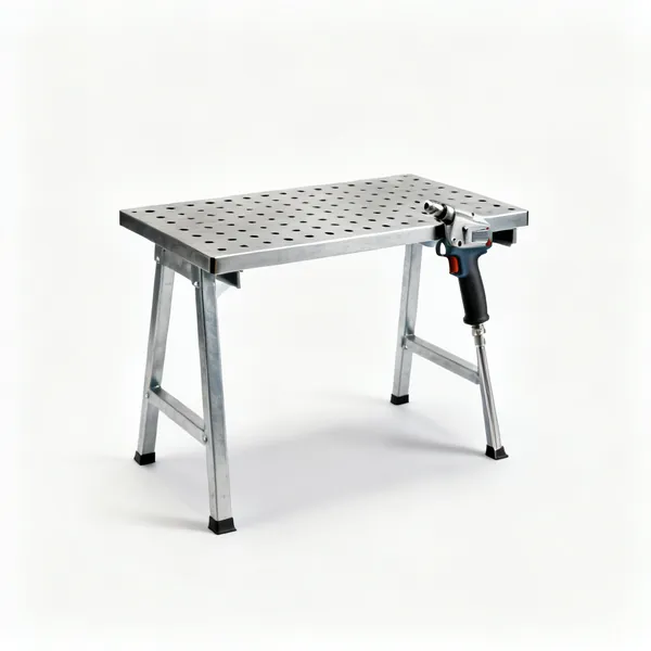 A steel welding table with a slotted top