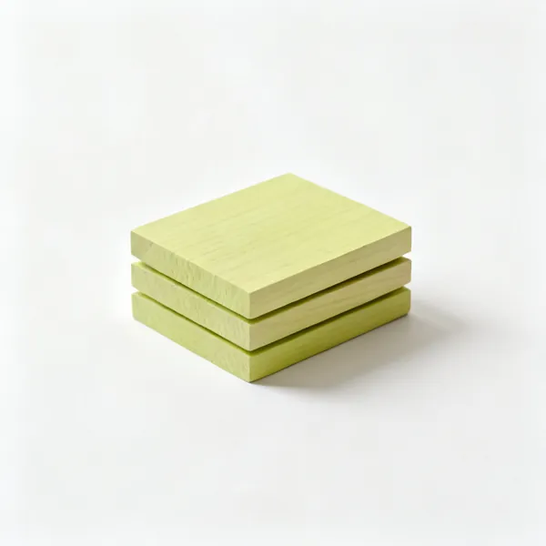 Lime carving blanks: A small stack of three rectangular pale lime wood carving blanks, arranged compactly with clear space at every edge