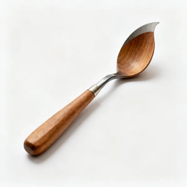 A wood carving spoon bent gouge with a blade curving upward to the cutting edge